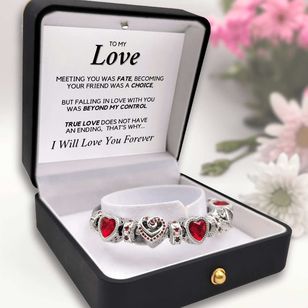 Red charm bracelet in box black with a message that reads: To My Love, Meeting you was fate, becoming your friend was a choice, but falling in love with you was beyond my control. True love does not have an ending, that's why... I Will Love You Forever.