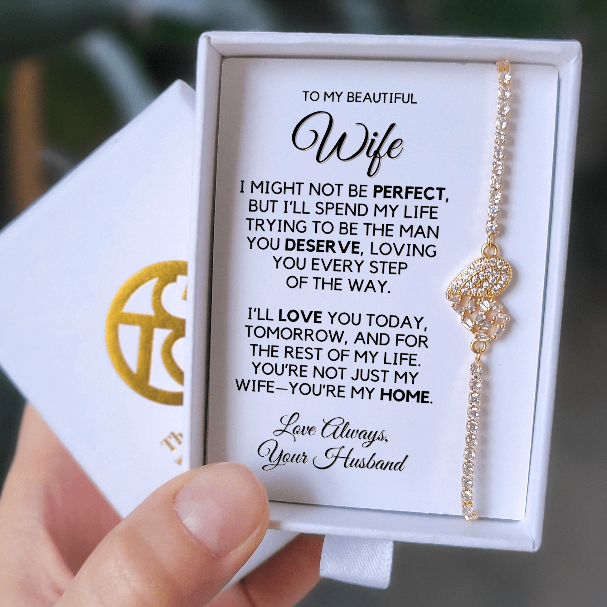 Photo of the 18K gold finish bracelet on the message card in the gift box