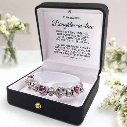 Bracelet with heart-shaped charms in a gift box with a heartfelt message to a daughter-in-law.