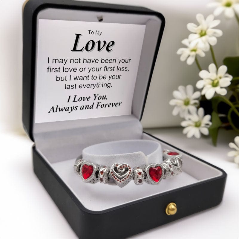 Red charm bracelet in box black with a message that reads:  To My Love, Meeting you was fate, becoming your friend was a choice, but falling in love with you was beyond my control. True love does not have an ending, that's why... I Will Love You Forever.