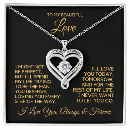 Heart shape necklace with cubic zirconia stones and writing that says, "I love you for always and forever" in a gift box with message card.