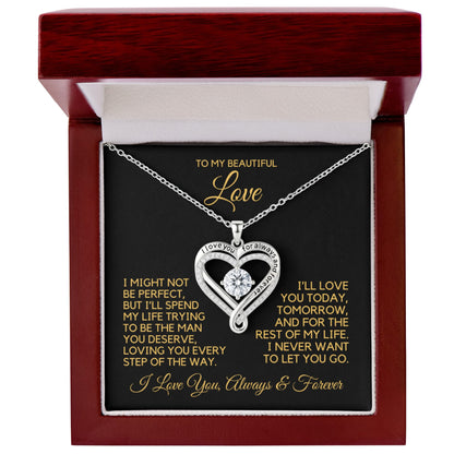 Heart shape necklace with cubic zirconia stones and writing that says, "I love you for always and forever" in a gift box with message card.