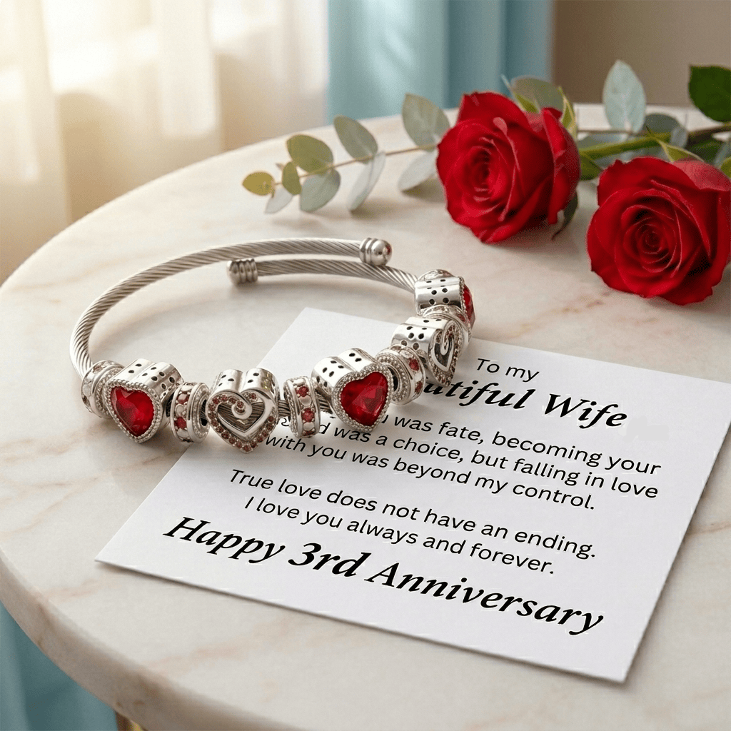 Silver bracelet with heart charms on a card for a wife's 3rd anniversary, accompanied by red roses.